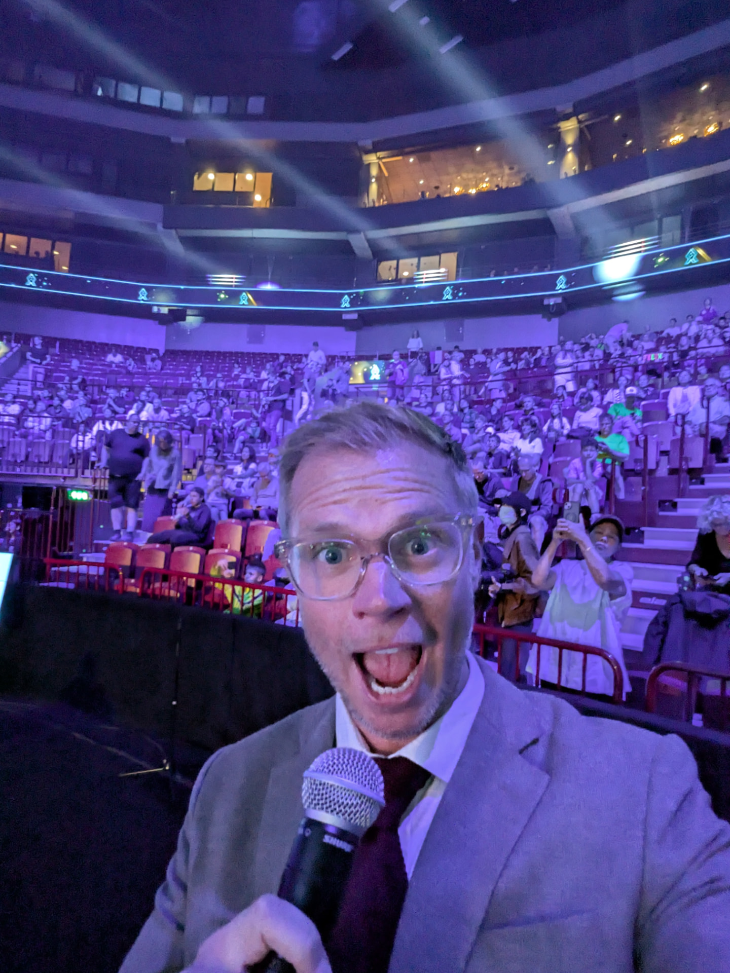 David as emcee with microphone in front of a full arena at Europe Smash Sweden 2026